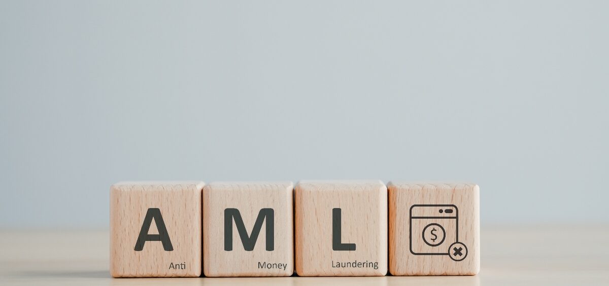 Dark professional background with bold text reading Anti-Money Laundering Laws Have Changed, Optima Partners branding